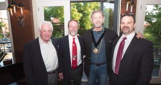 Image of Hayden Mcllroy with three other men