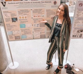 Christina Trexler standing in front of her research