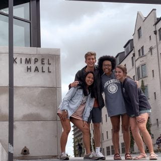 Mica Ela Vitug with friends in front of Kimpel Hall